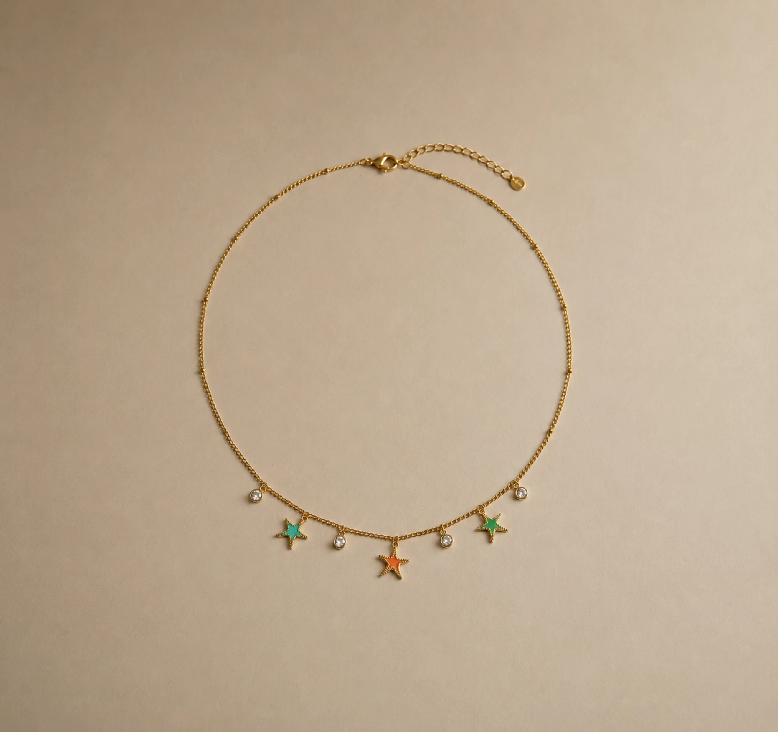 Collier en acier, inoxydable à fines breloques , étoiles et strass